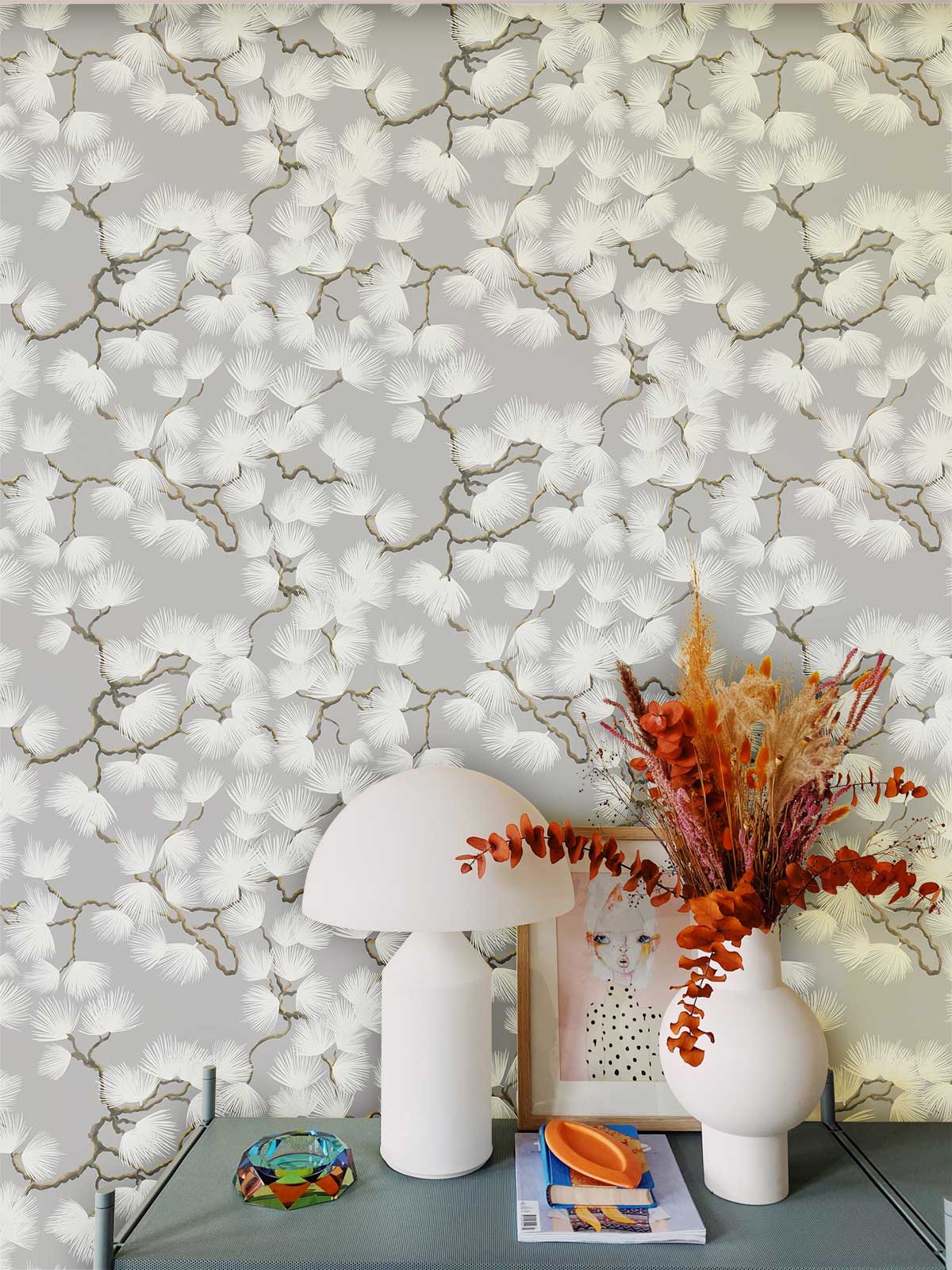 Elegant grey floral pattern wallpaper with white lamp, vase; modern botanical design in living room.