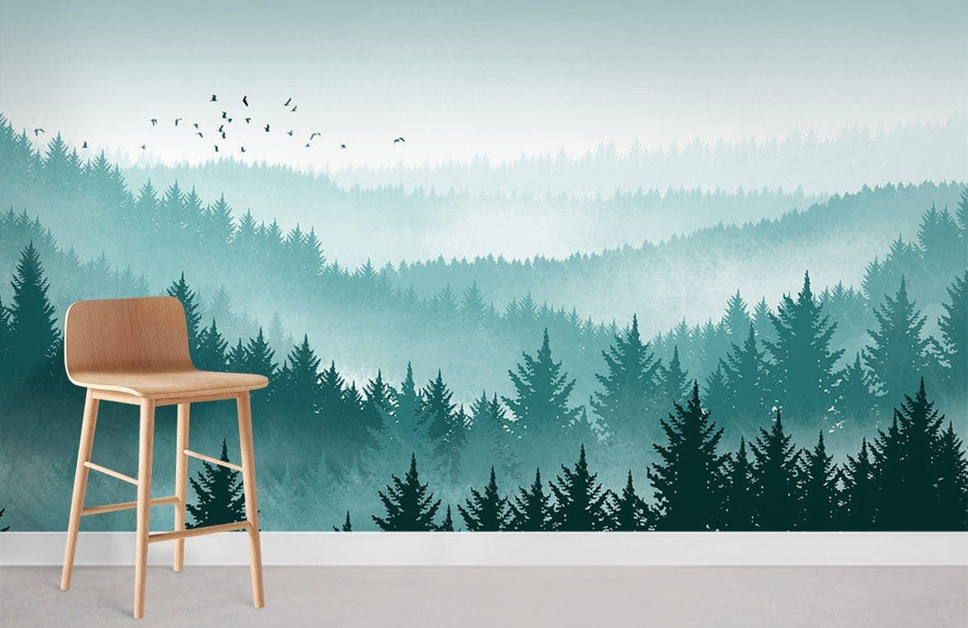 Alt text: Forest green mural wallpaper featuring misty trees, wooden chair, serene wall decor, room interior.