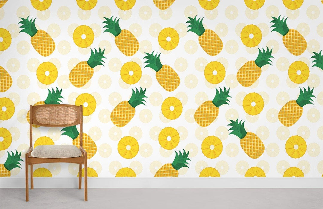 Tropical pineapple wallpaper in vibrant yellow and green, featuring a wooden chair and grey flooring.