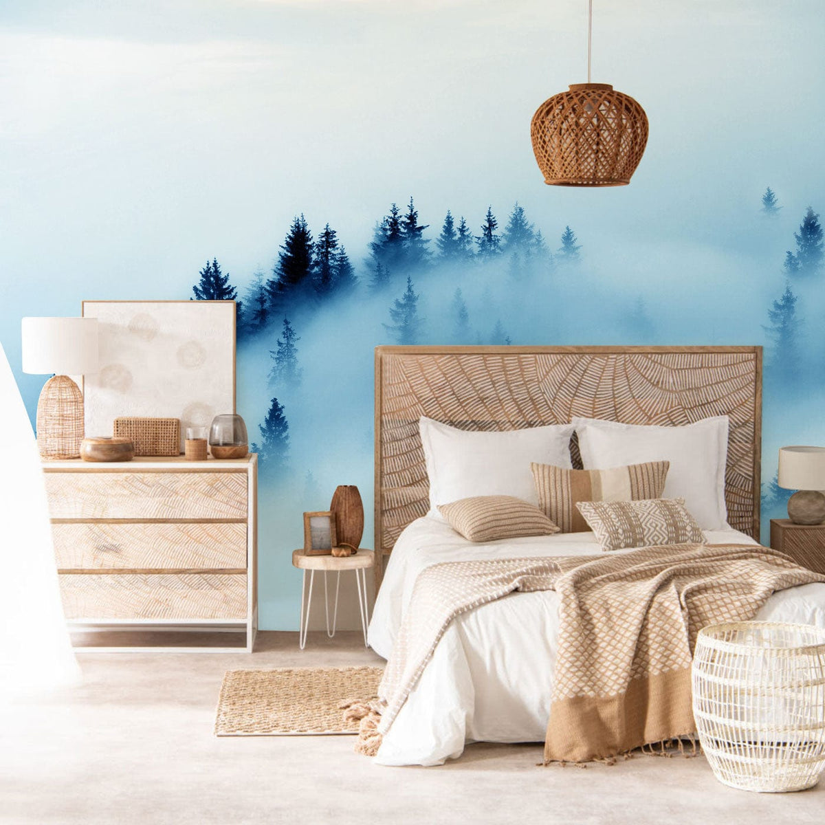Serene Misty Forest Mural in bedroom with wicker bed, soft beige tones, and tranquil blue accents.