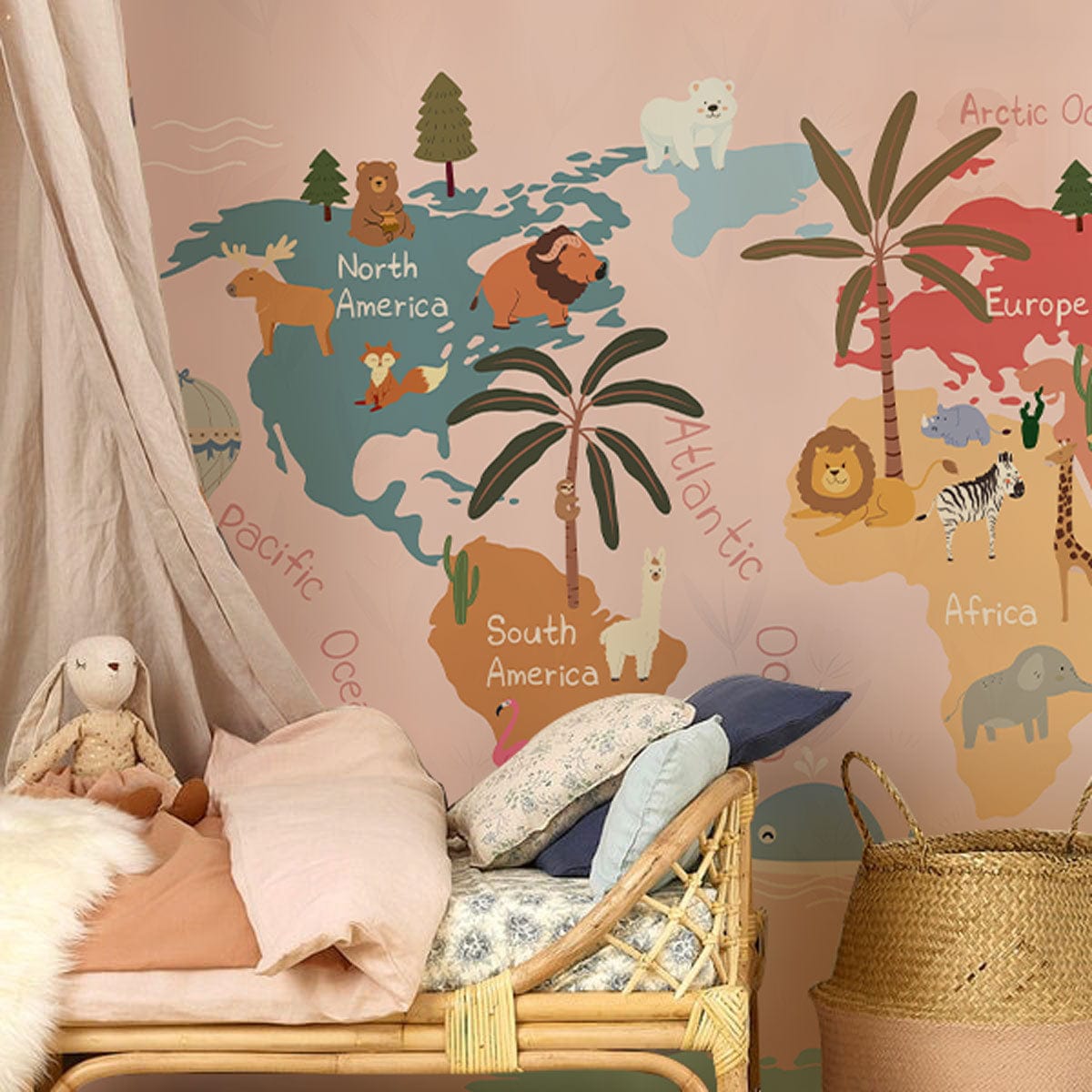 Whimsical pastel world map kids' wallpaper; rattan chair, pink walls, cosy bedroom decor, animal adventure.