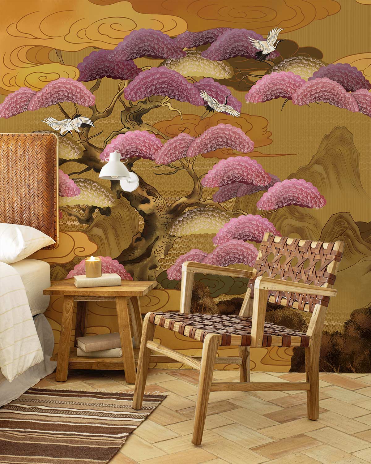 Elegant golden landscape wallpaper featuring birds, pink trees; wicker chair; herringbone flooring; cosy bedroom.