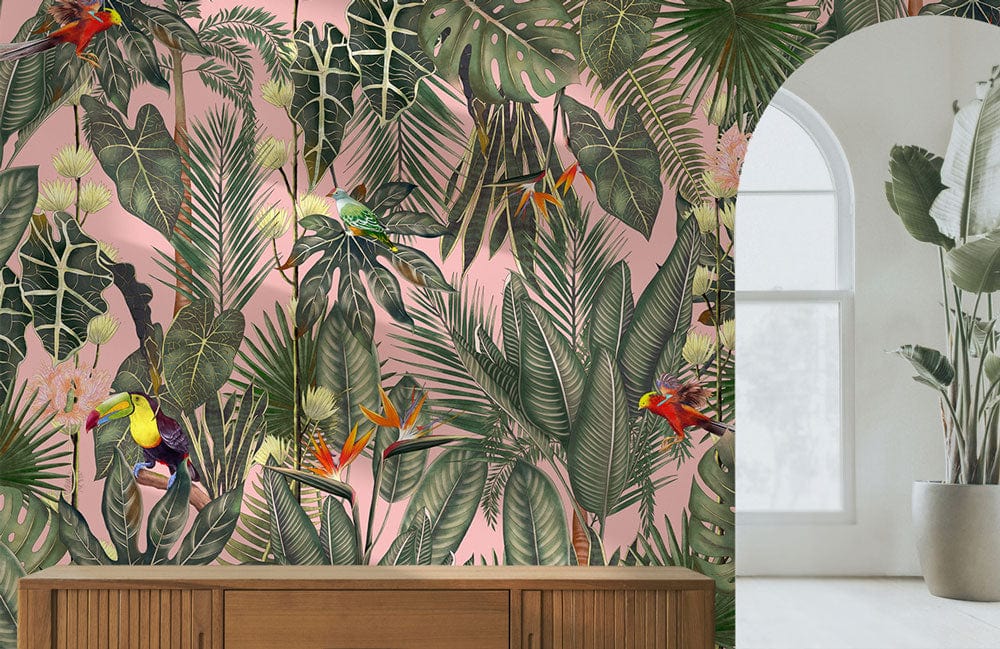 Tropical Paradise Botanical Wallpaper on pink wall with wooden console, large window, and lush decor.