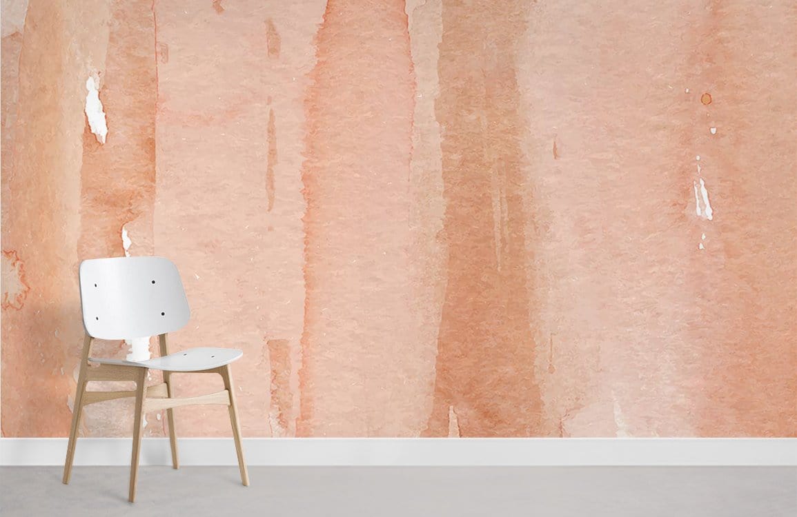 Peach watercolour mural wallpaper in modern room with simple wooden chair on light grey flooring.