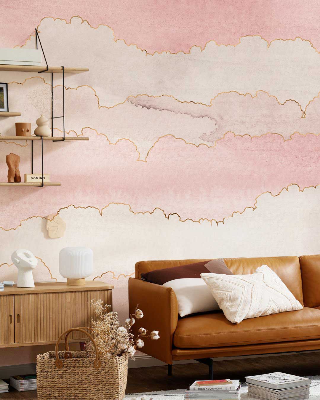 Elegant Blush Pink Watercolour Clouds wallpaper in living room; tan leather sofa, light wood flooring.