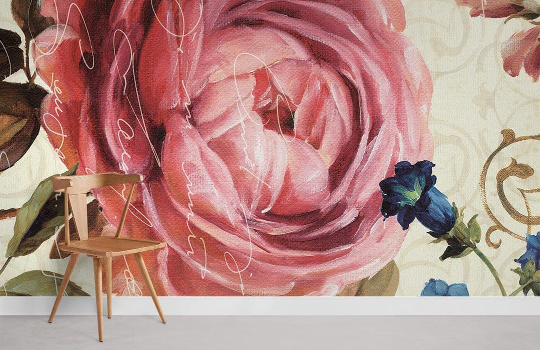Vintage floral mural wallpaper with pink roses, script, and wooden chair in a modern living space.