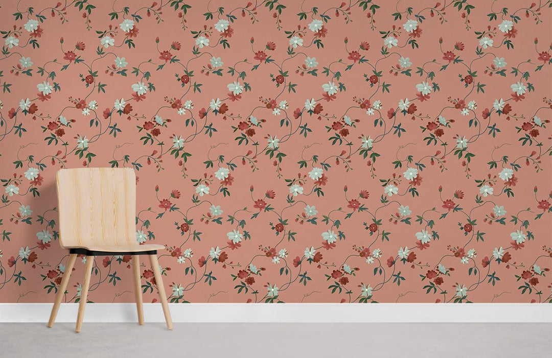 Vintage floral wallpaper in coral rose, delicate botanical pattern next to a light wooden chair.