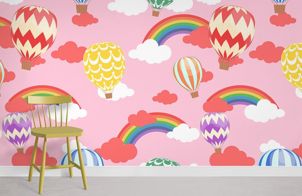 Colourful hot air balloon and rainbow children's wallpaper mural, pink theme, green chair, light floor.