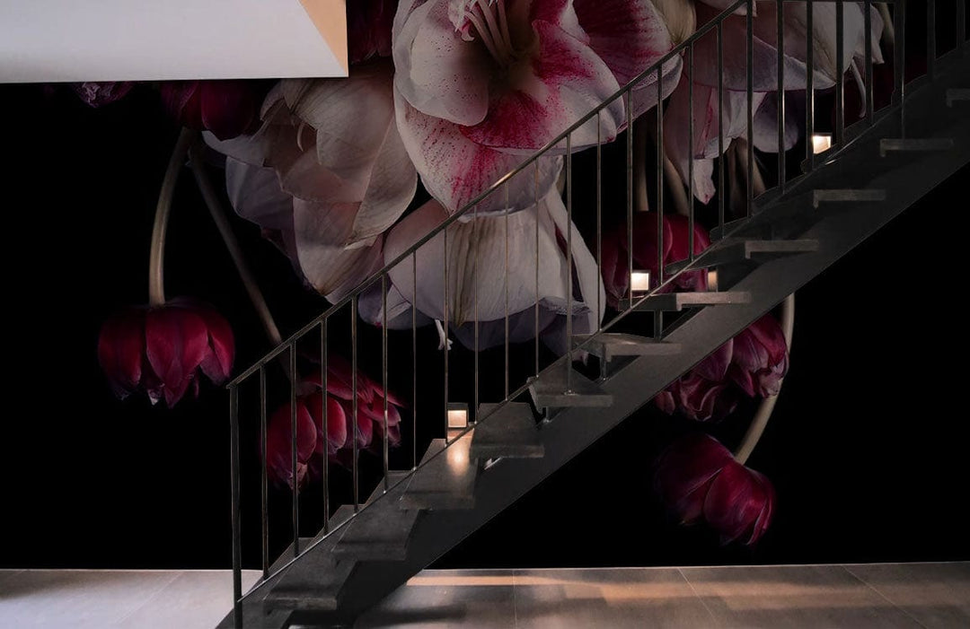 Luxurious Dark Floral Elegance Wallpaper with dramatic blooms behind modern staircase, wooden flooring enhances ambiance.