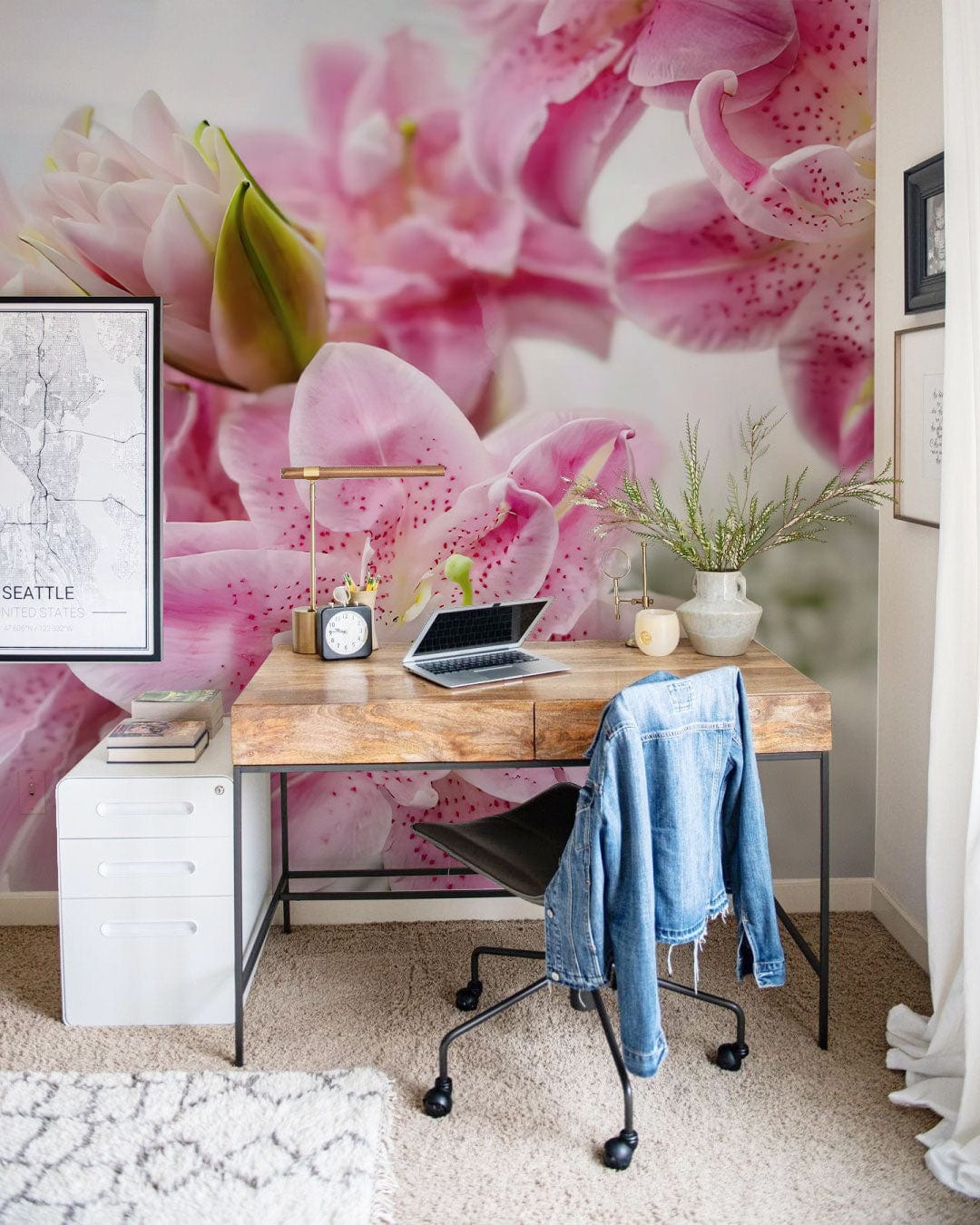 Elegant pink lily mural wallpaper in modern home office with wooden desk and grey carpet flooring.