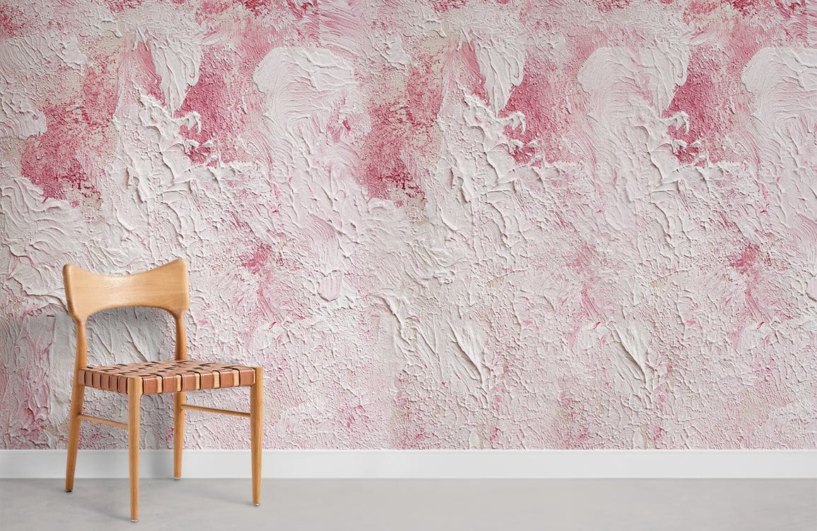 Blush pink textured abstract wall mural in contemporary room with wooden chair and concrete flooring.