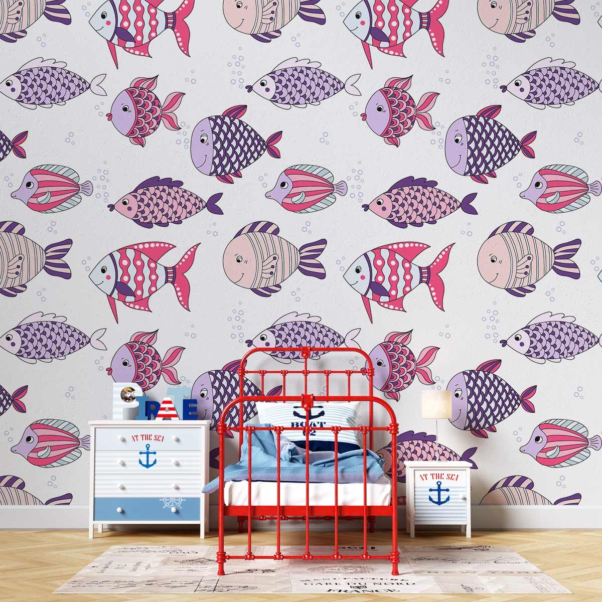Pastel fish wallpaper in child's room with red bed, nautical theme dresser, light wood flooring.