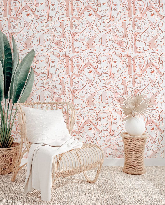 Abstract line art wallpaper with rattan chair, beige rug, and decor in a modern interior.
