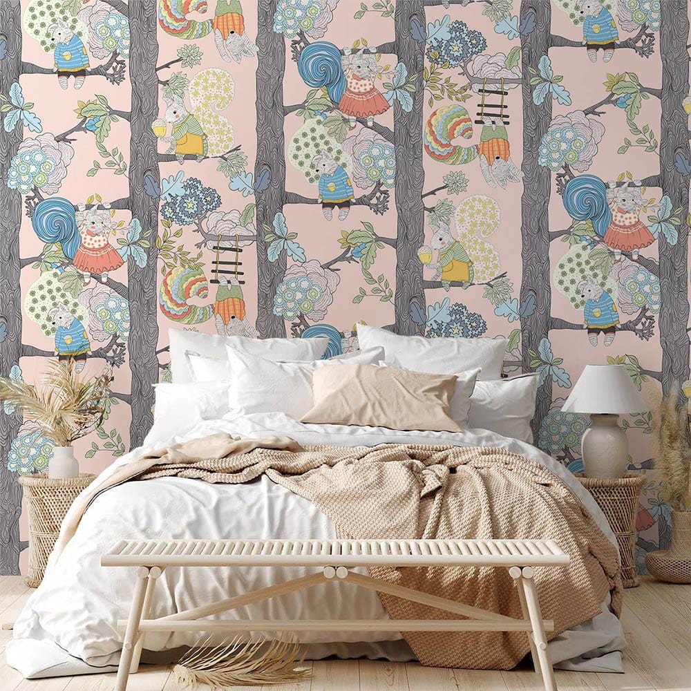 Whimsical woodland animals wallpaper in nursery with cosy bed, white bedding, light wood flooring.