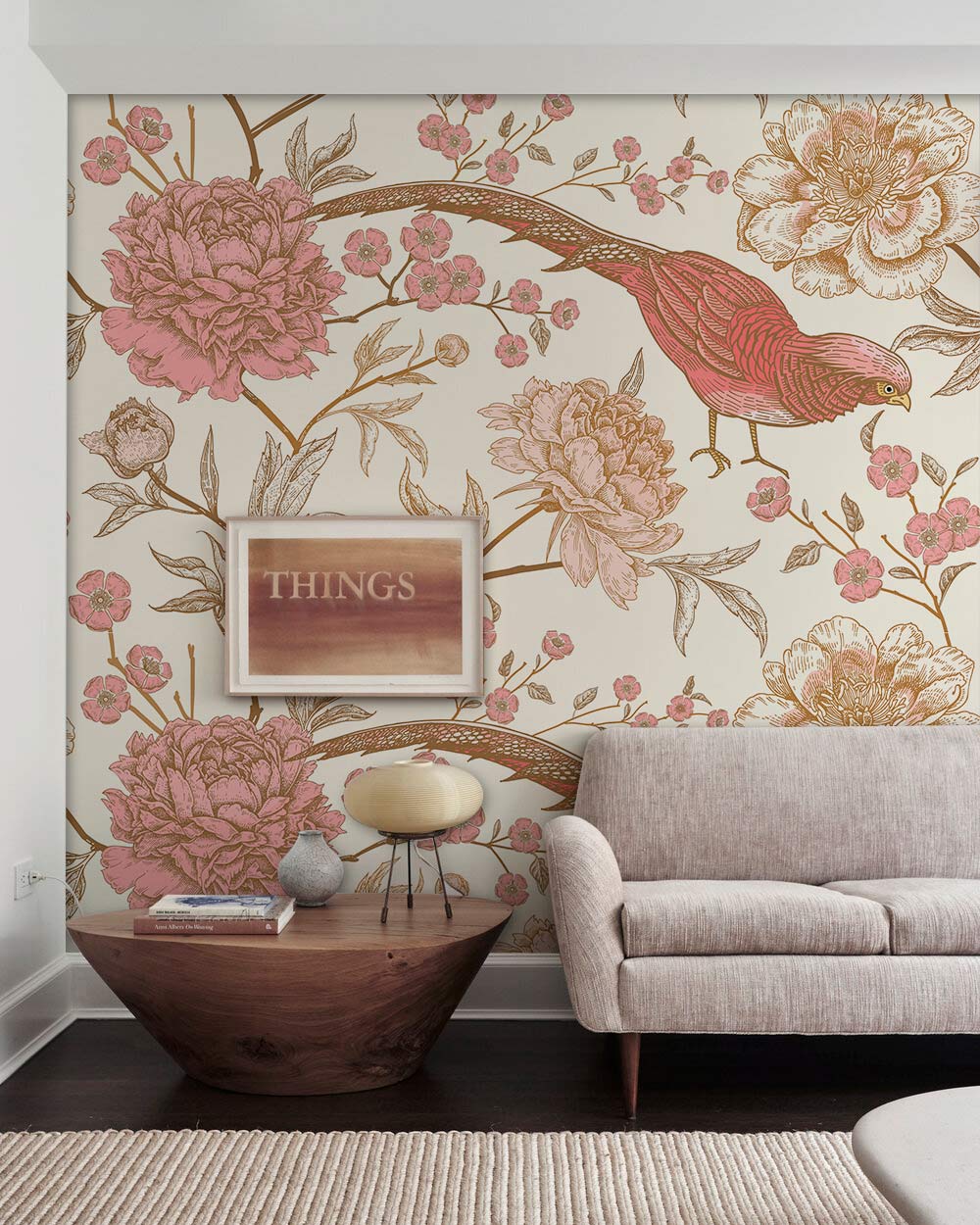Elegant vintage bird floral wallpaper in pink and cream, beige sofa, modern room with wood table.