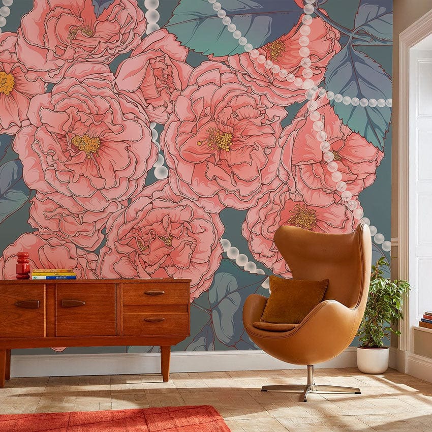 Elegant vintage floral wallpaper in coral and teal with pearl accents, mid-century cabinet, leather chair.
