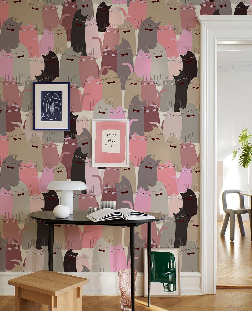 Charming pastel cats wallpaper; elegant cosy Décor; beige wall; black table; light wooden flooring.