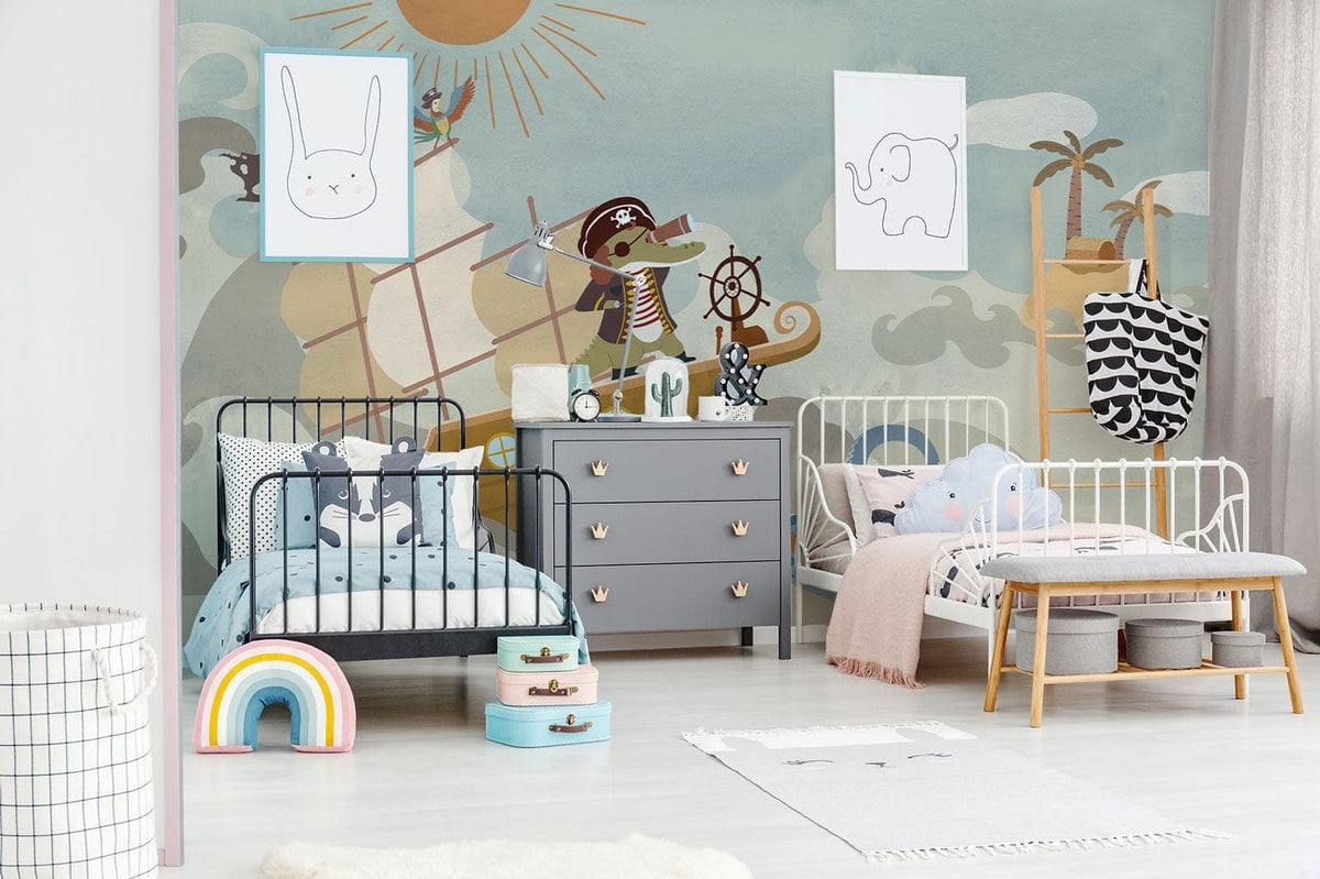 Children's room with nautical pirate mural, white metal beds, grey dresser, playful decor elements.