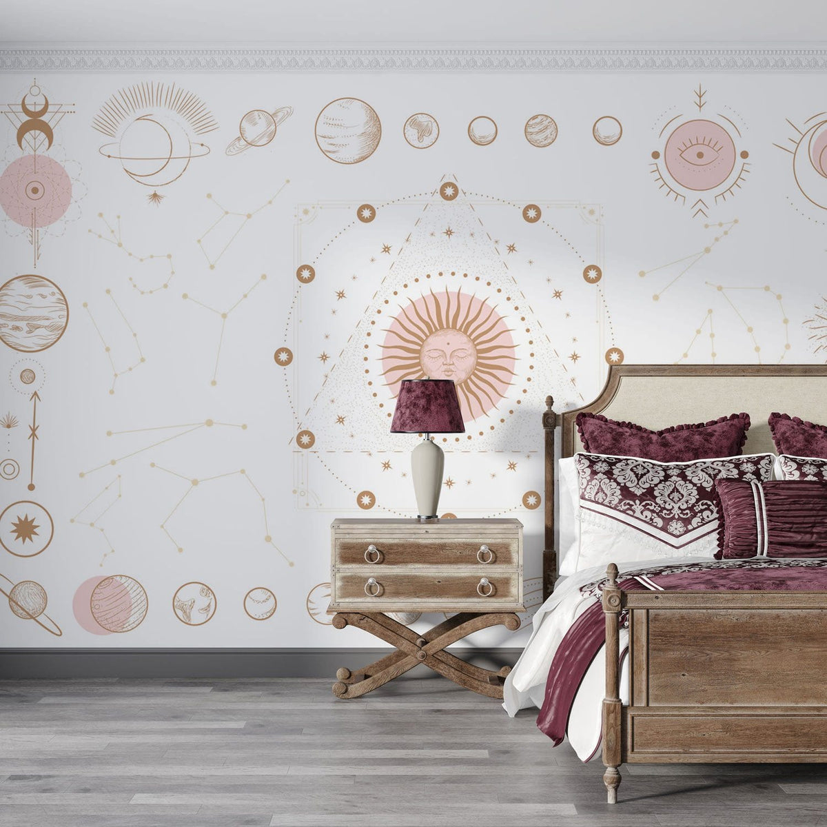 Celestial Sun and Moon mural in bedroom with wooden bed, patterned maroon cushions, grey hardwood floor.