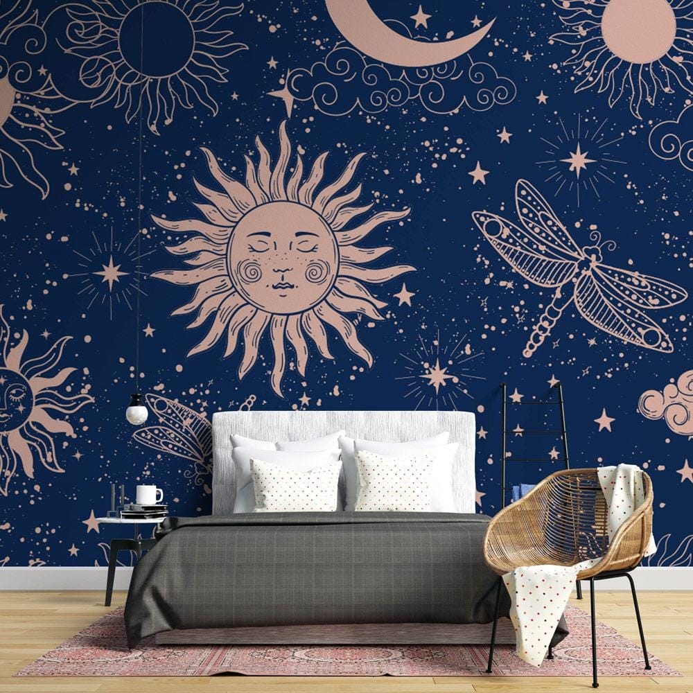 Midnight blue wallpaper with sun, moon, dragonfly; grey sofa, boho decor, light wood flooring in living room.