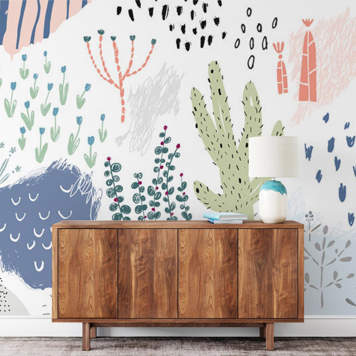 Colourful botanical desert wallpaper with pastel cactus design and wooden sideboard in modern room.
