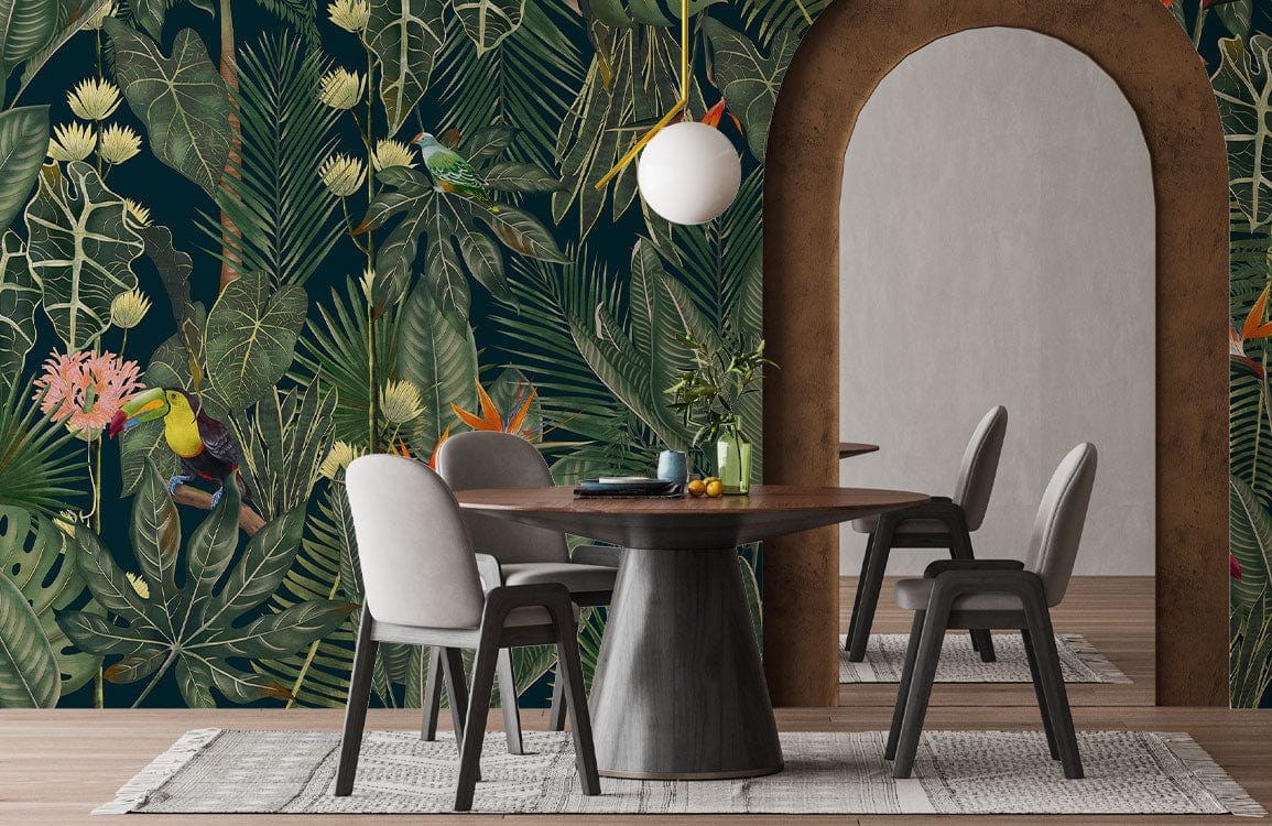 Dining room with dark green exotic foliage mural, round table, grey chairs, and hanging light.