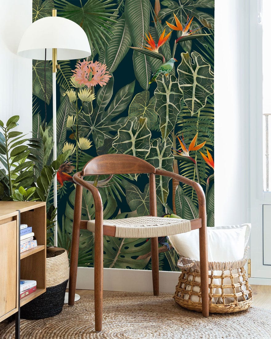 Tropical Jungle wallpaper with wooden chair, woven rug, light wood furniture; vibrant foliage in modern room.