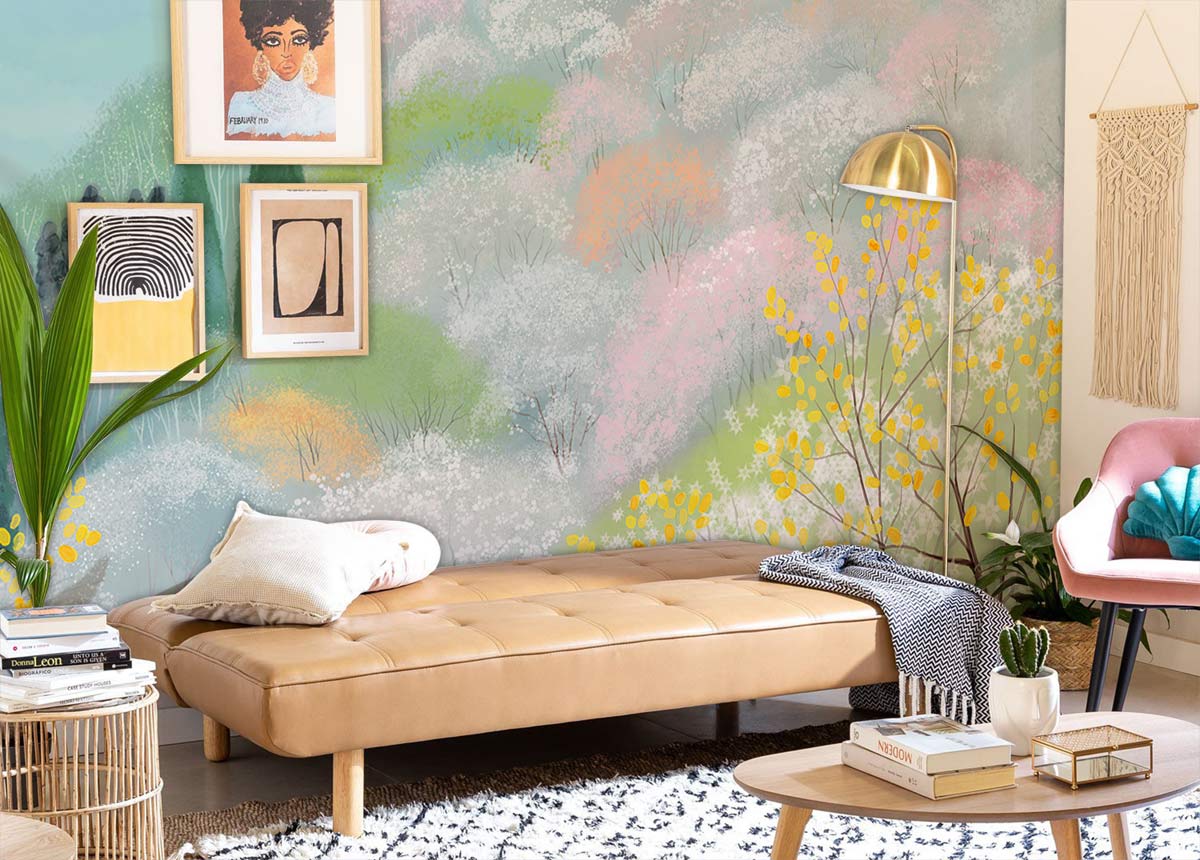 Serene mural wallpaper in pastel mountain design, soft-coloured lounge with tan sofa, artistic decor, and rug.
