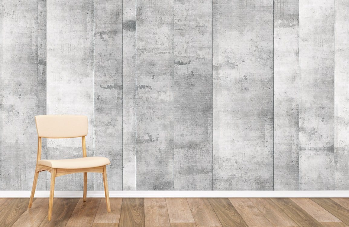 Industrial grey wallpaper in modern room with wooden flooring and beige chair. Urban decor style.