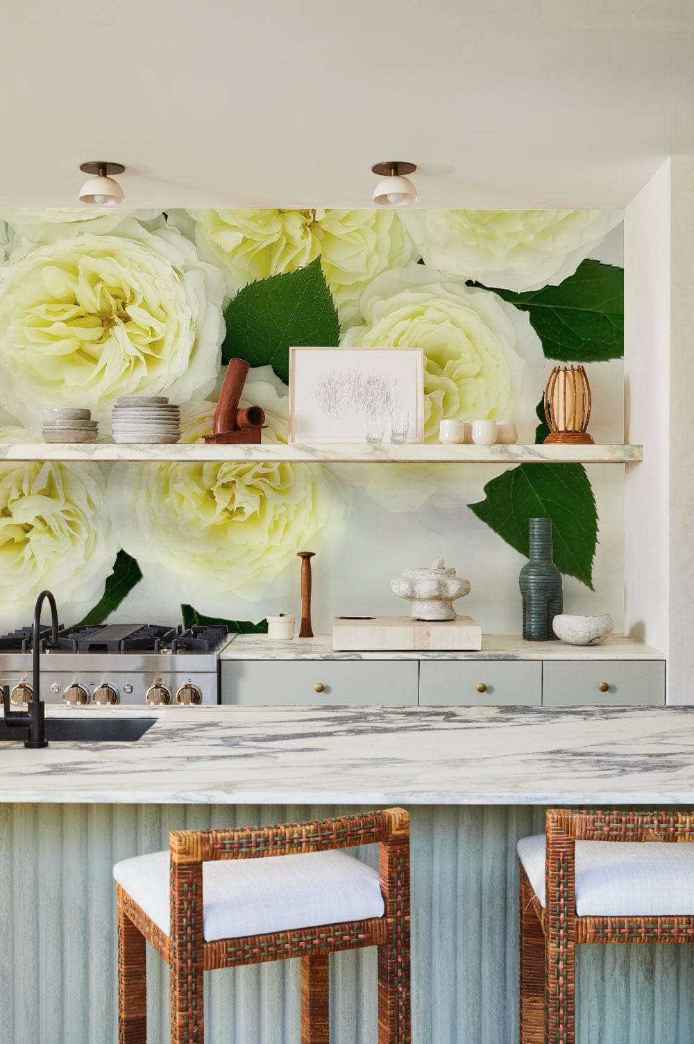 Cream Rose Floral Elegance wallpaper with cream kitchen decor, marble countertop, wicker barstools, serene atmosphere.