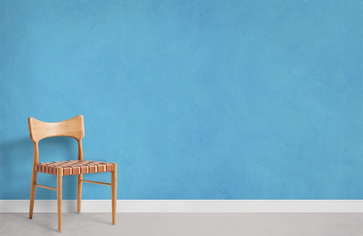 Elegant Sky Blue Textured Mural Wallpaper with wooden chair, grey flooring in modern interior design setting.