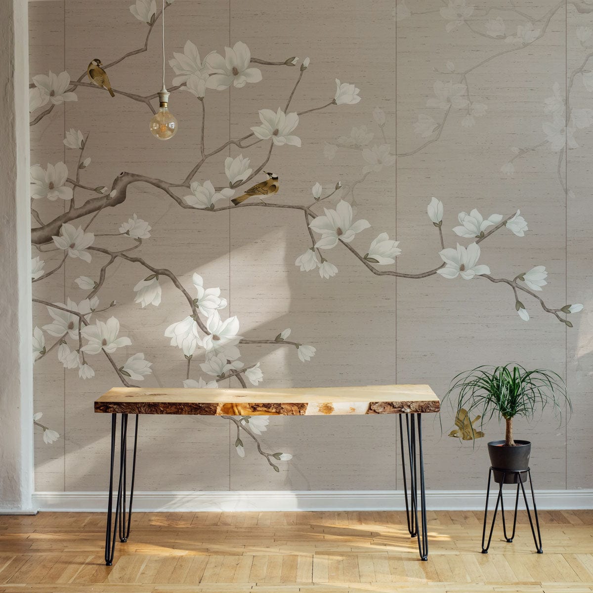 Elegant Blossom beige floral mural wallpaper featuring birds, branches; minimalist table, wooden flooring, pendant light.