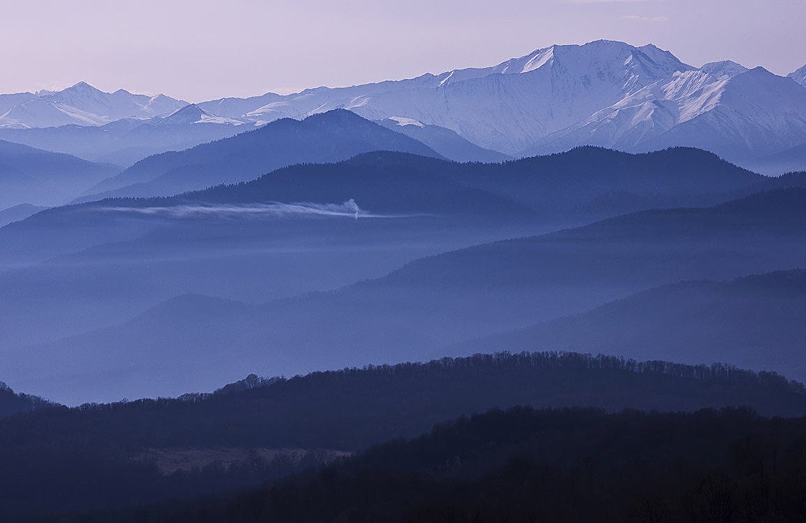 Serene Mountain Mist Blue Landscape Mural Wallpaper for Tranquil Interiors