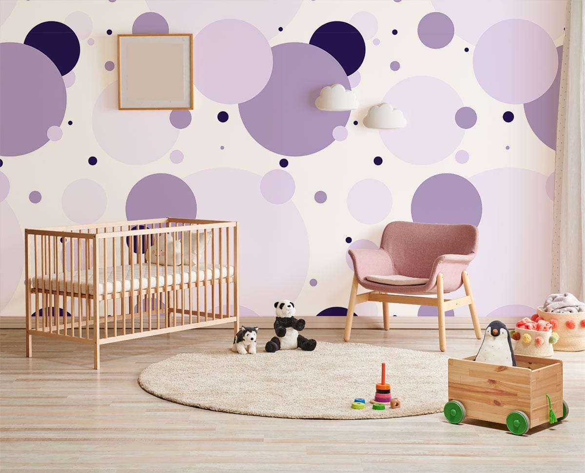 Lilac Lavender Polka Dot Wallpaper in nursery with wooden crib, modern chair, and light wood flooring.