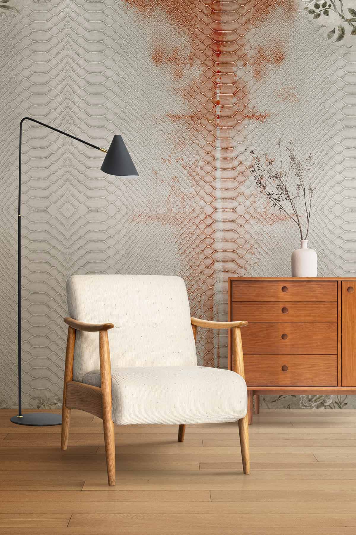 Vintage floral snake pattern wallpaper, cream and rust tones, with armchair, wooden sideboard, lamp.