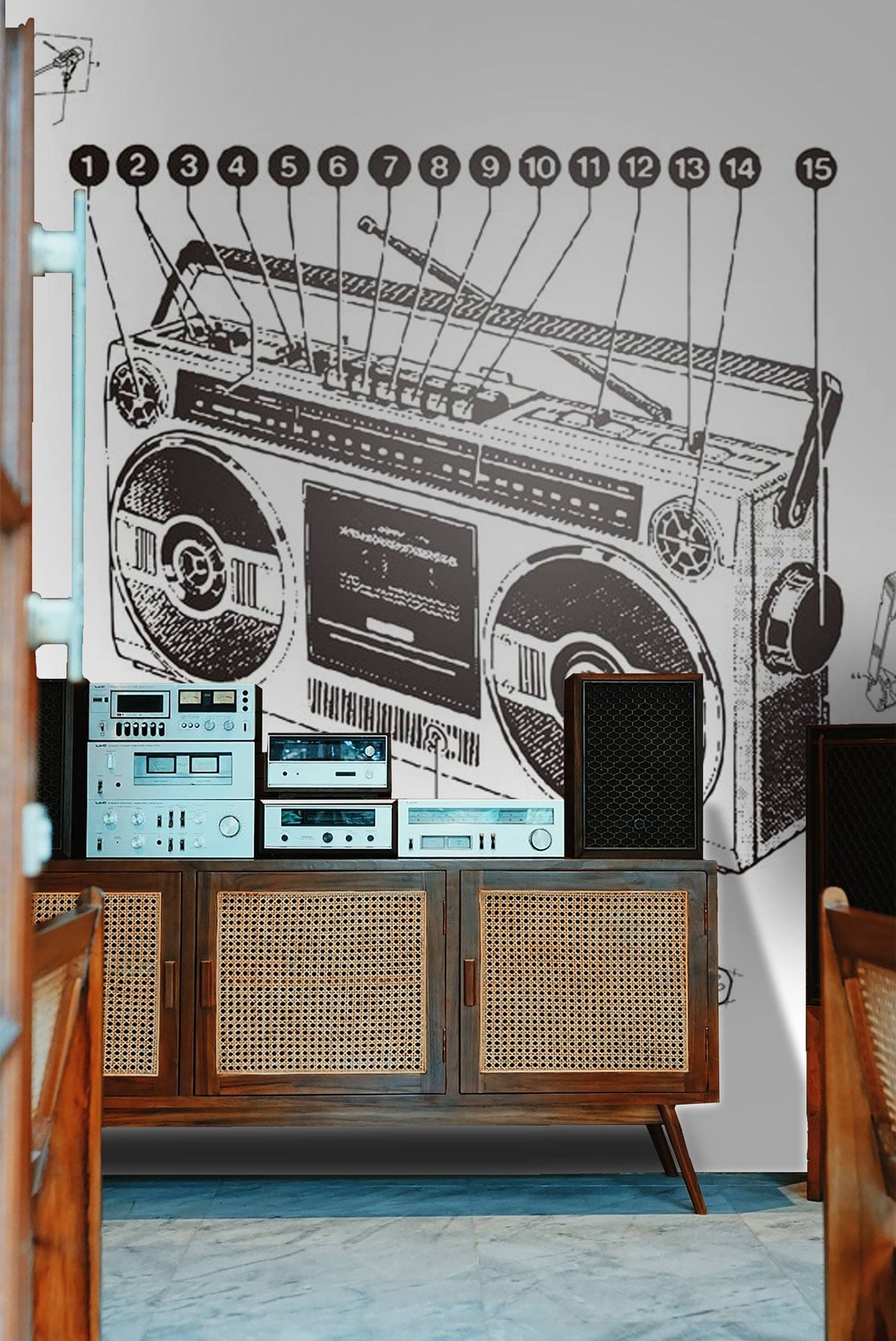 Retro Boombox Blueprint Mural Wallpaper in vintage monochrome, wooden cabinet, blue-grey flooring, mid-century chairs.