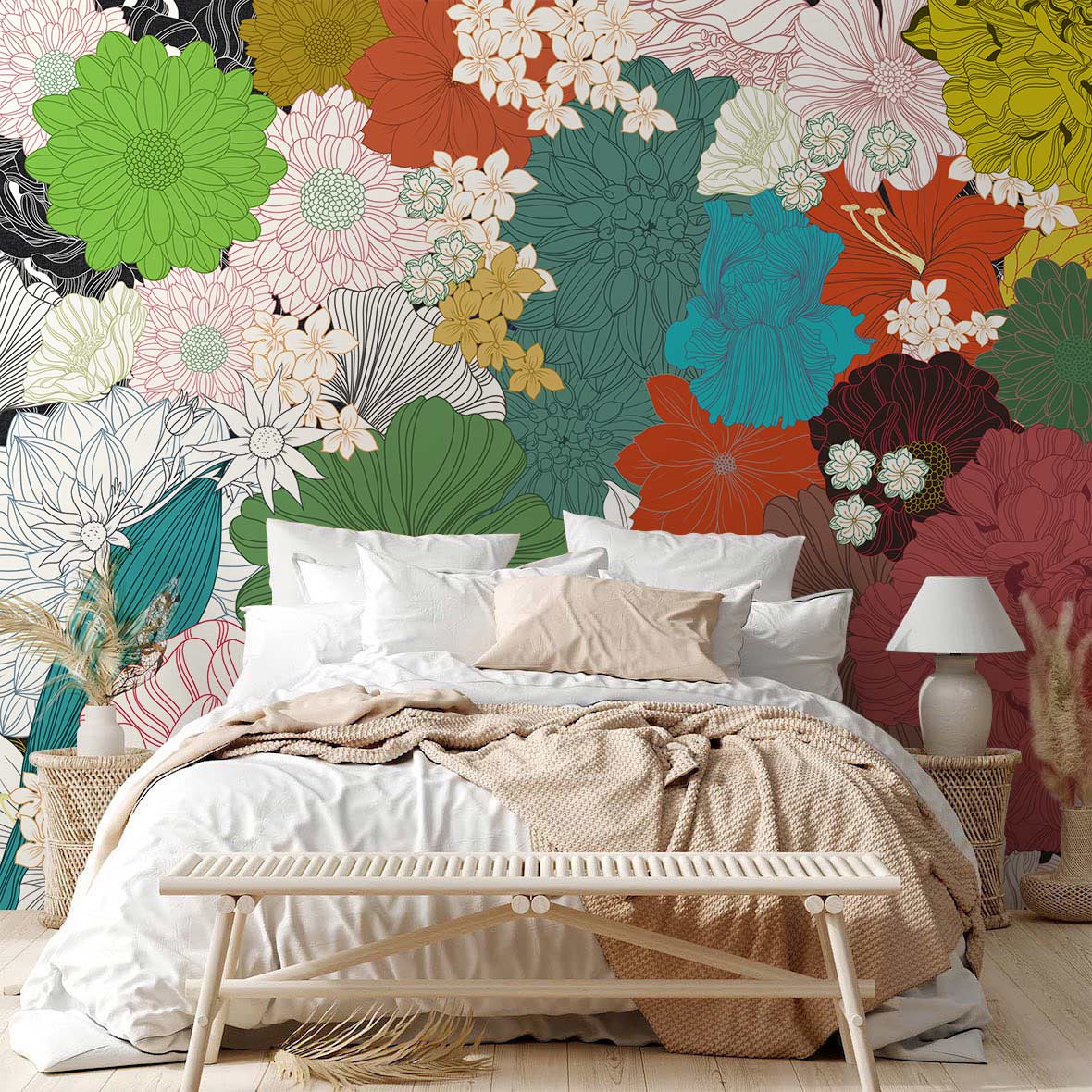 Vibrant multicolour floral pattern wallpaper in bedroom with white bed, beige throw, and woven lamps.