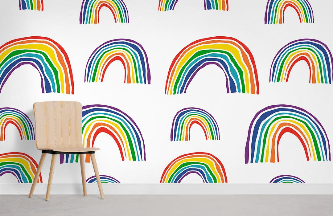 Vibrant rainbow pattern wallpaper in kids' room with wooden chair, grey floor, colourful decor delight.