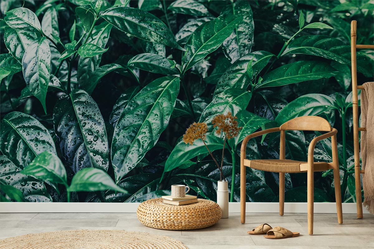 Luxurious green foliage botanical wallpaper in stylish living room with wooden chair and woven rug.