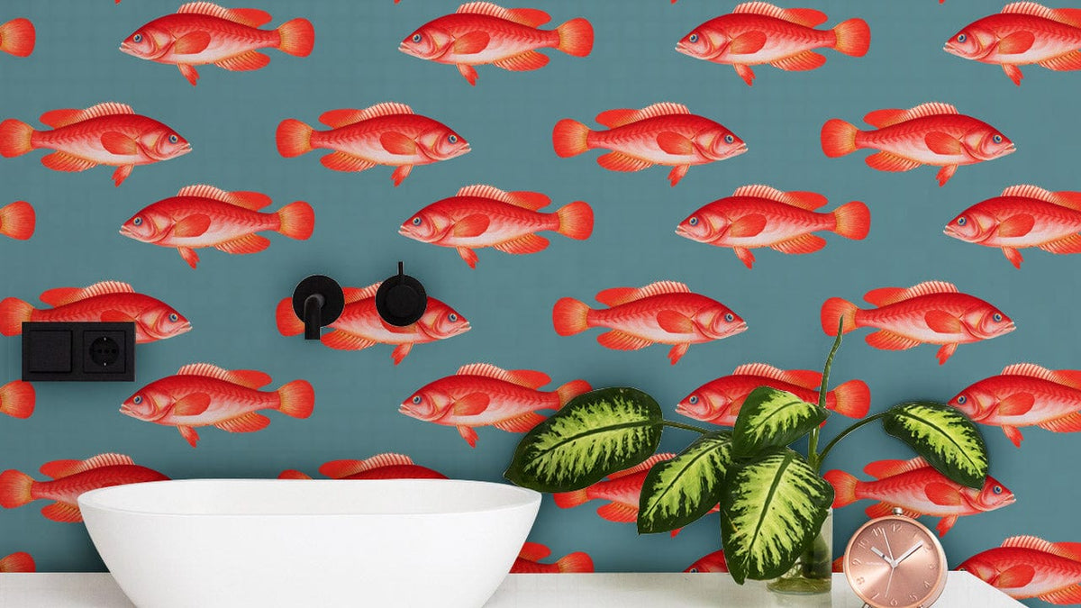 Vibrant red fish wallpaper enhances coastal design with white basin and greenery, creating stunning elegance.