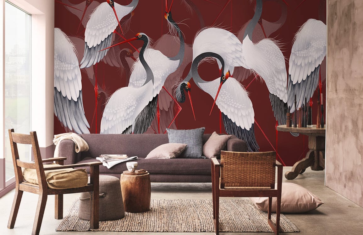 Rich red mural with elegant cranes behind modern grey sofa, wooden armchairs, beige rug in living room.