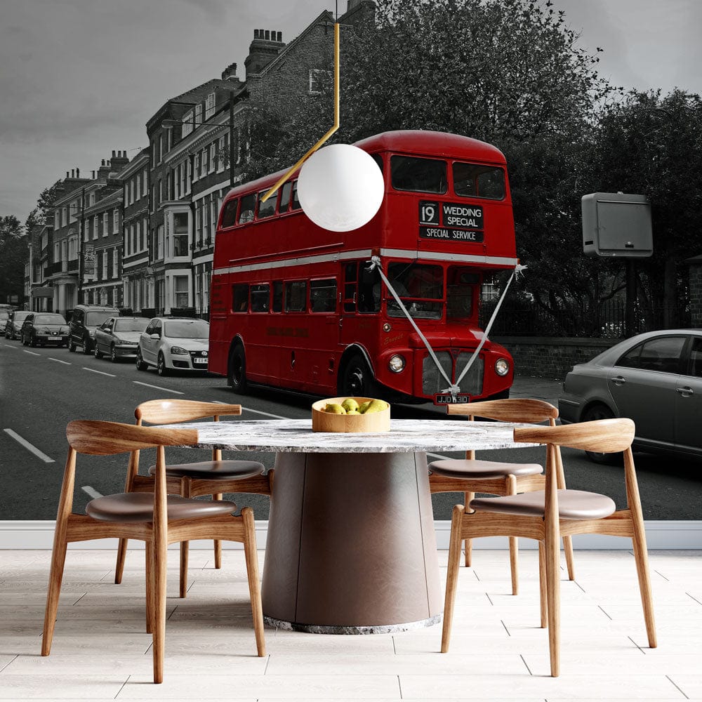 Vintage London Red Bus wallpaper with wooden dining chairs, round table, and modern pendant light.