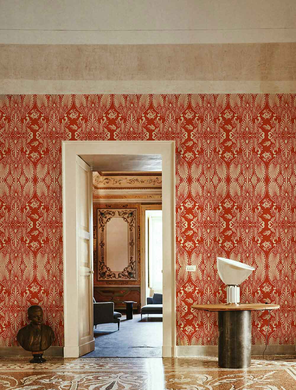 Vintage Damask Wallpaper, ornate floral design, red and cream, living room, marble flooring, modern table.