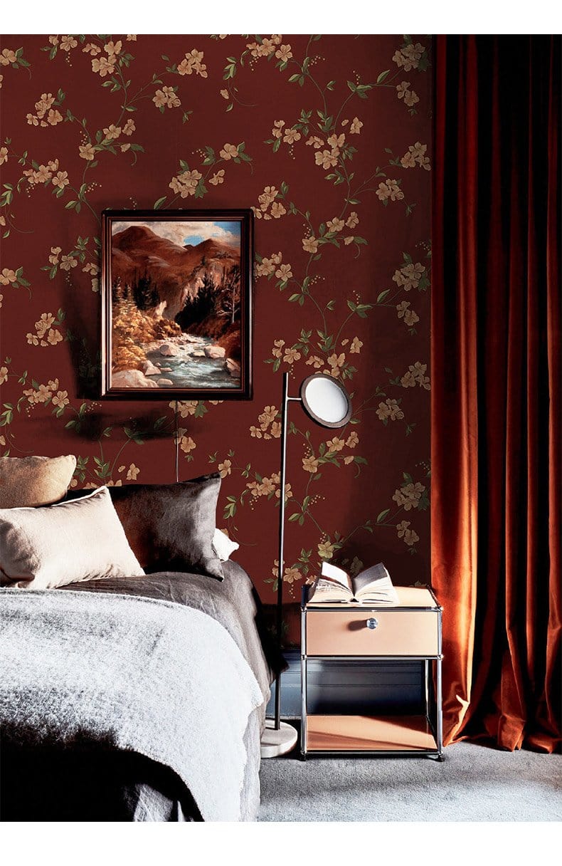 Elegant Vintage Floral Wallpaper in bedroom, maroon backdrop, grey bedding, silver nightstand, velvet curtain.