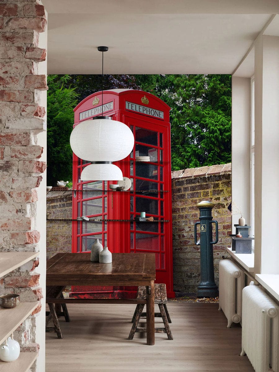 Classic Red British Telephone Box Wallpaper in rustic kitchen with exposed brick and wooden dining table.