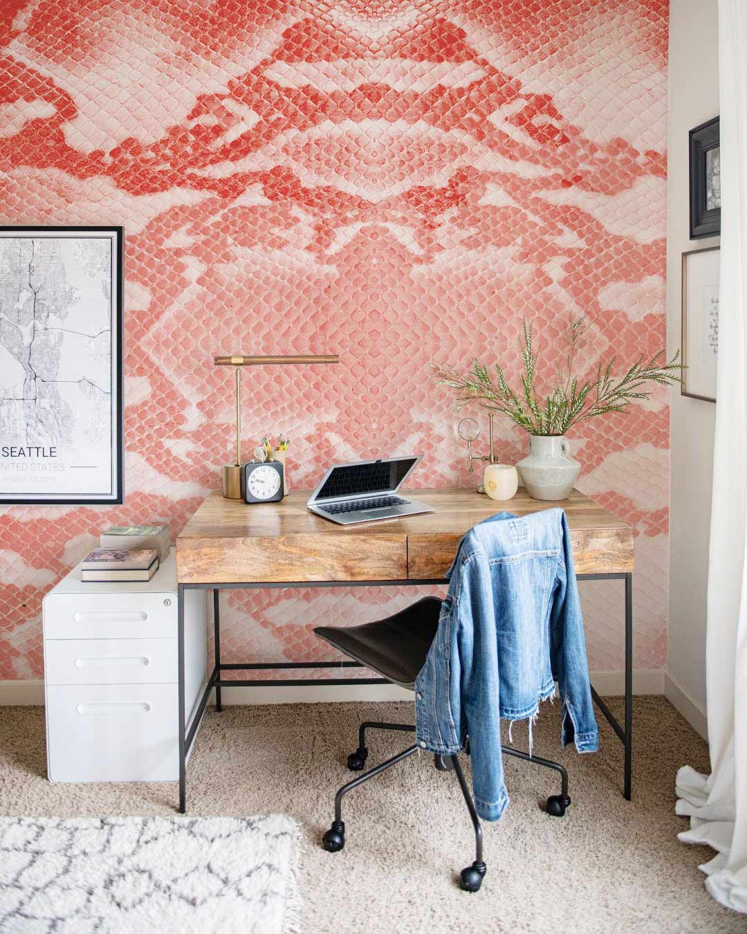 Coral and White Snakeskin Wallpaper in home office, featuring wooden desk and black chair.
