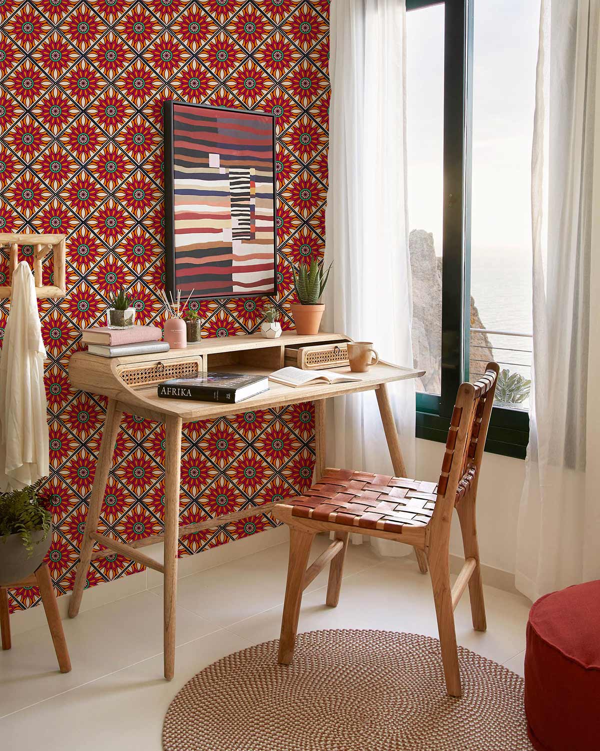Vibrant Geometric Floral Pattern Wallpaper, with wooden desk, chair, and rug in stylish room.