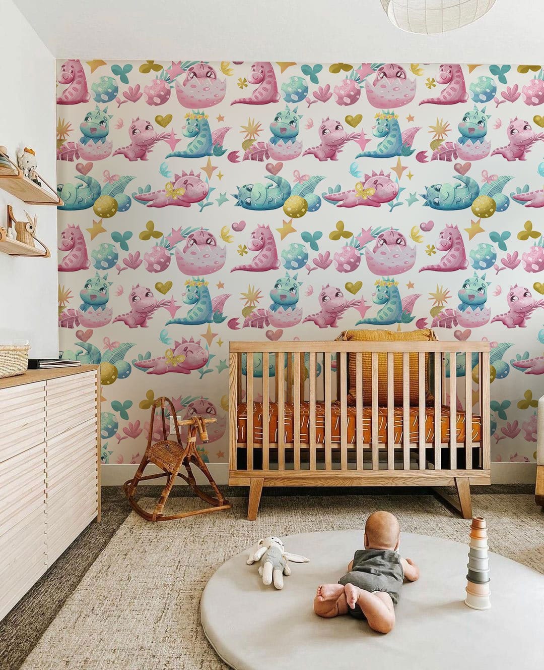 Enchanting pastel fantasy wallpaper for nursery, with wooden cot, light rug, and natural flooring.
