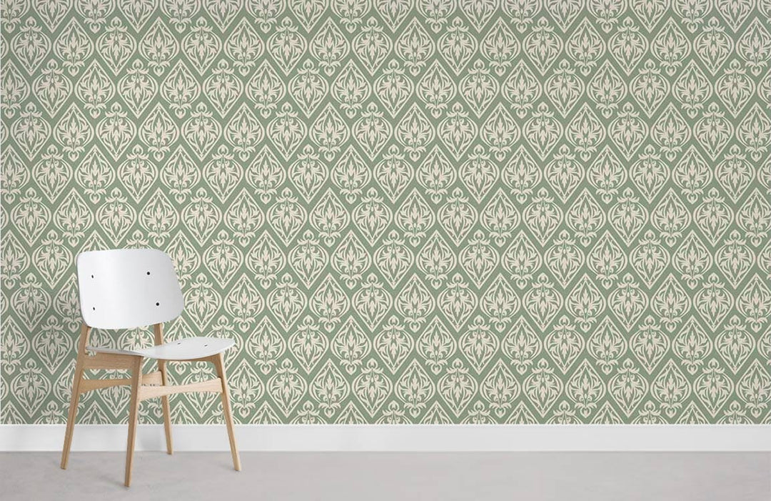 Victorian-inspired damask sage green wallpaper with white chair on grey wooden floor. Elegant interior design.