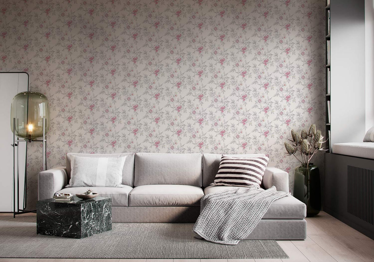 Elegant pink and white floral wallpaper in modern living room with grey sofa and marble table.